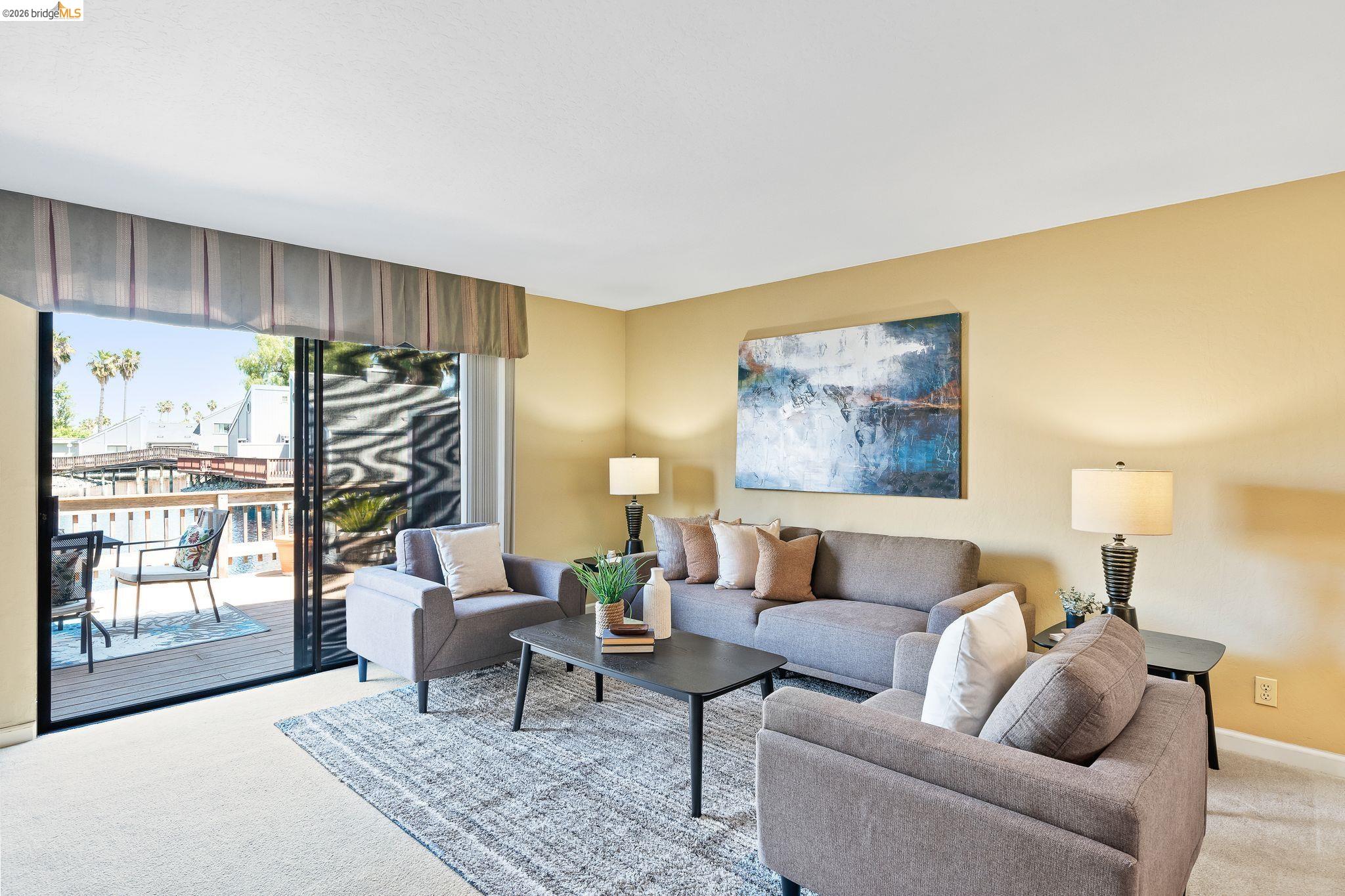 2051 Sand Point Road Discovery Bay, CA 94505 - Photo 10 of 47 Living area with sliding glass door access to an outdoor deck