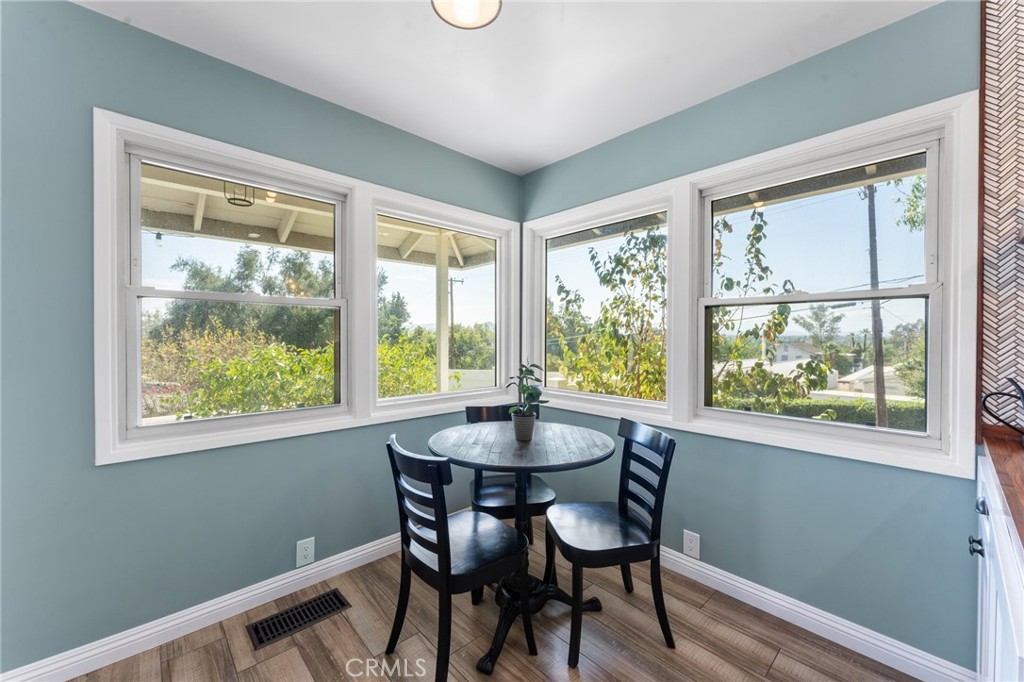 4380 Miramonte Place Riverside, CA 92501 - Photo 21 of 73 a dining room with wooden floor and a window