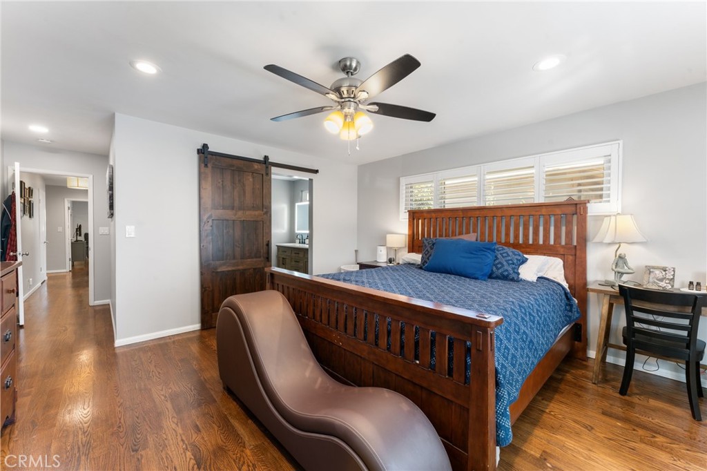 4380 Miramonte Place Riverside, CA 92501 - Photo 24 of 73 a bedroom with a bed and a chandelier