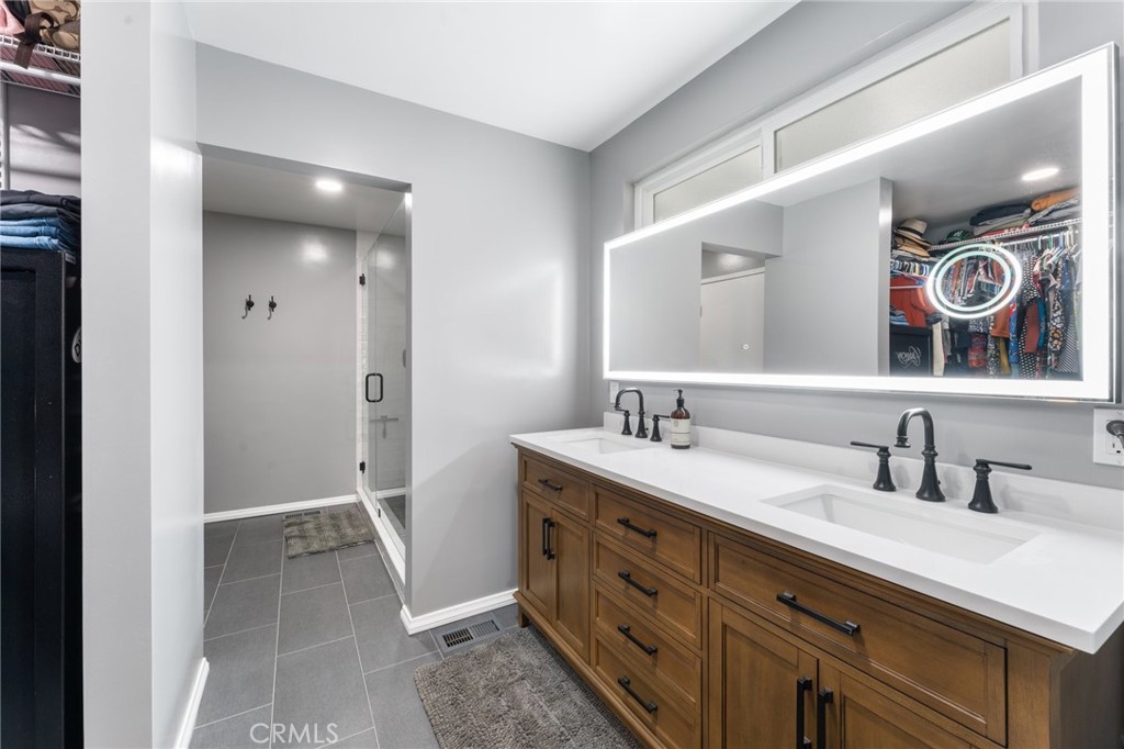 4380 Miramonte Place Riverside, CA 92501 - Photo 26 of 73 a bathroom with a sink and a mirror