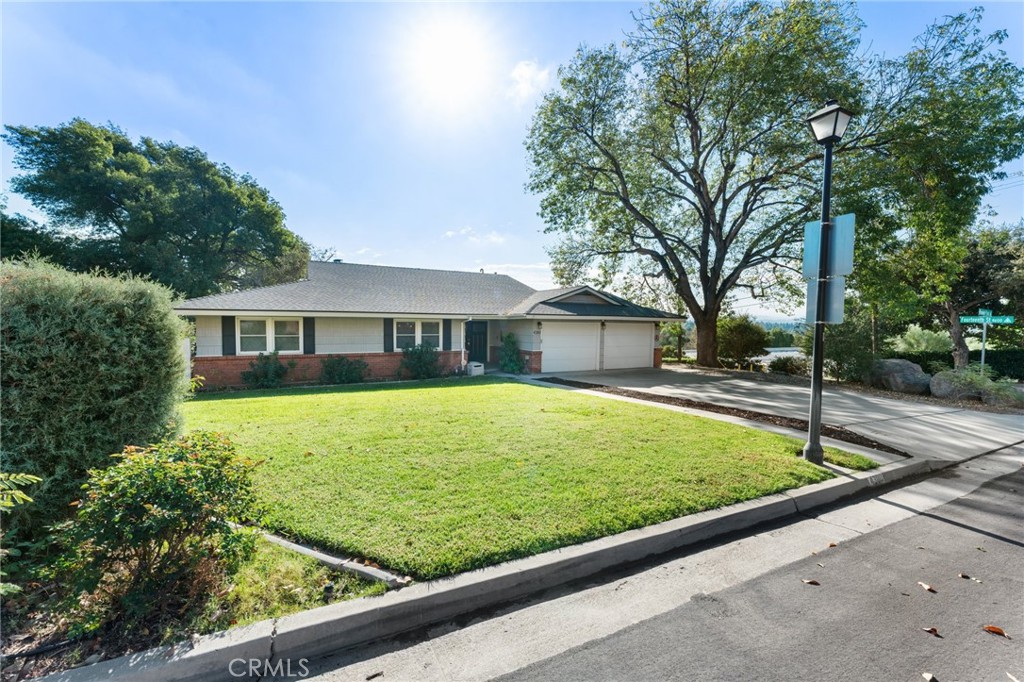 4380 Miramonte Place Riverside, CA 92501 - Photo 3 of 73 a front view of house with yard and trees around
