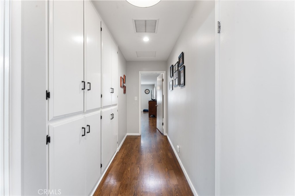 4380 Miramonte Place Riverside, CA 92501 - Photo 35 of 73 a view of a hallway with wooden floor