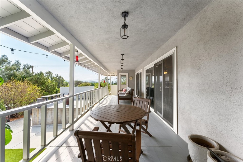 4380 Miramonte Place Riverside, CA 92501 - Photo 44 of 73 a view of a balcony with furniture and wooden floor