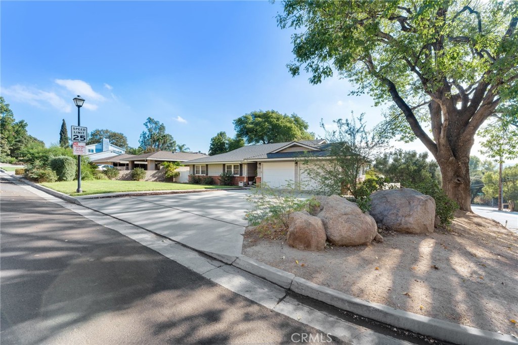 4380 Miramonte Place Riverside, CA 92501 - Photo 57 of 73 a front view of a house with garden