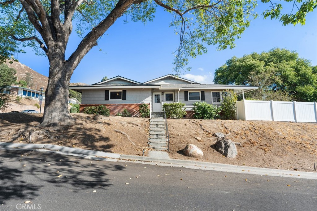 4380 Miramonte Place Riverside, CA 92501 - Photo 59 of 73 a front view of a house with a yard