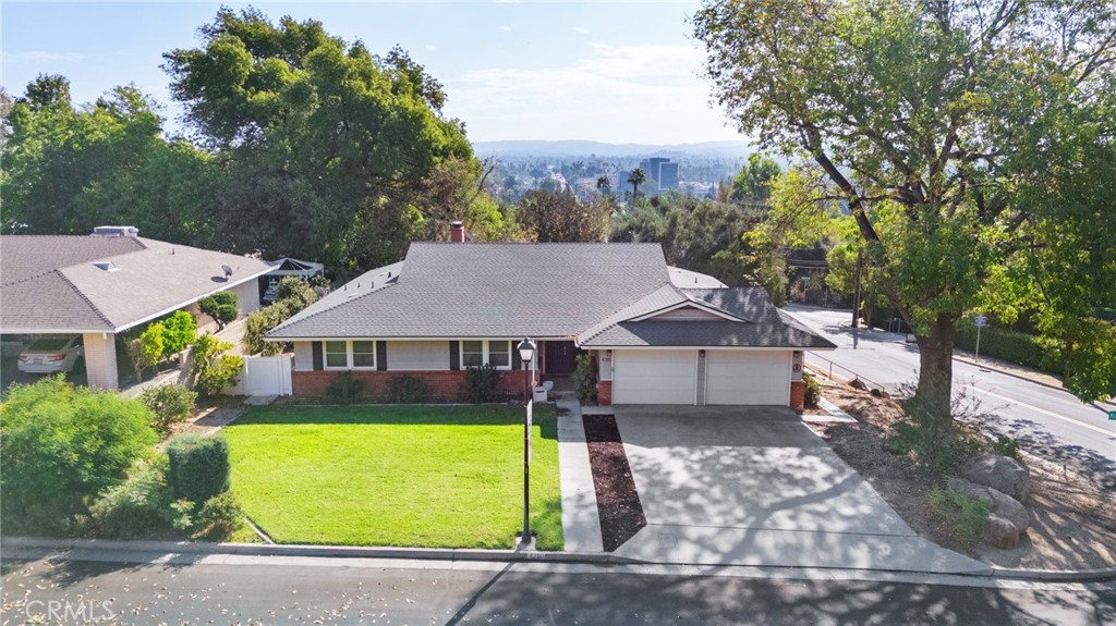 4380 Miramonte Place Riverside, CA 92501 - Photo 63 of 73 an aerial view of a house with a garden and yard