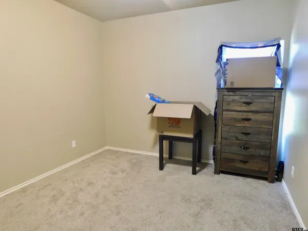 a view of room with furniture and a potted plant