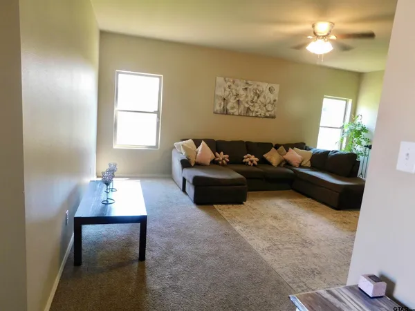 a living room with furniture and a window