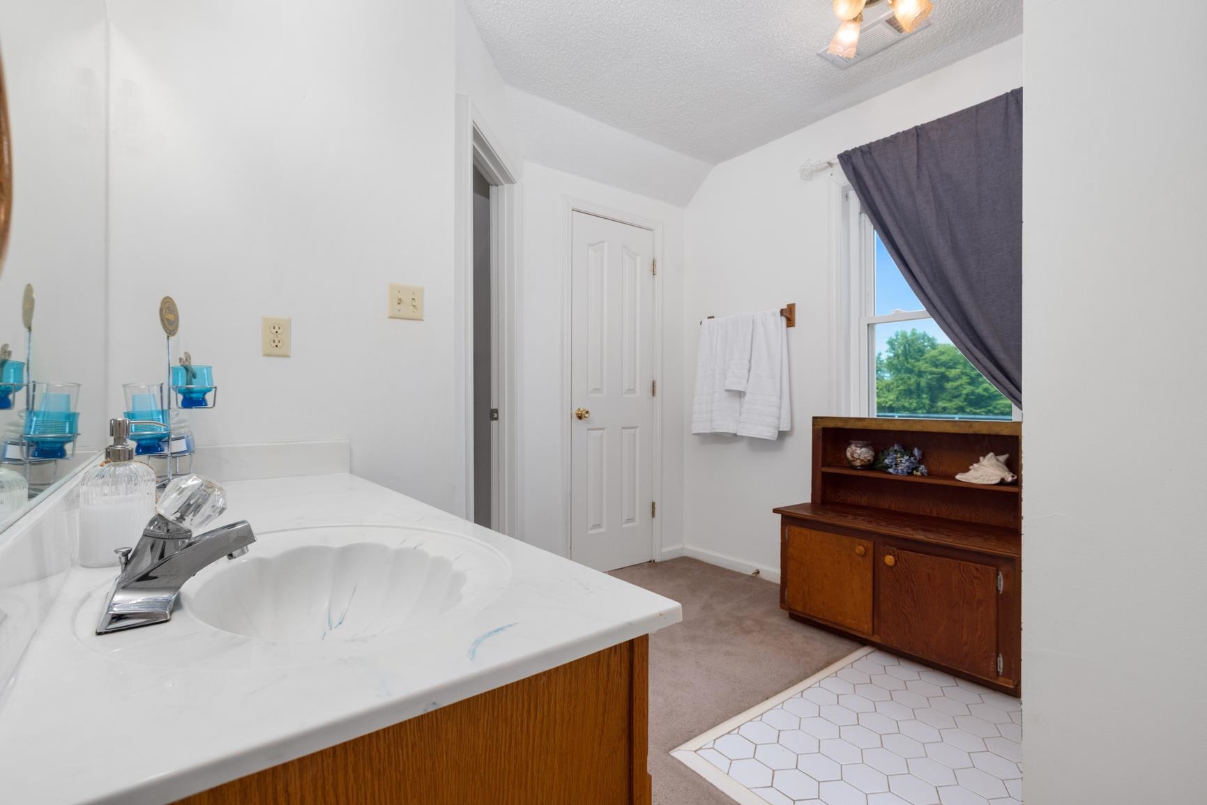 8539 Campground Road Drummonds, TN 38023 - Photo 29 of 38 a bathroom with a sink and a mirror