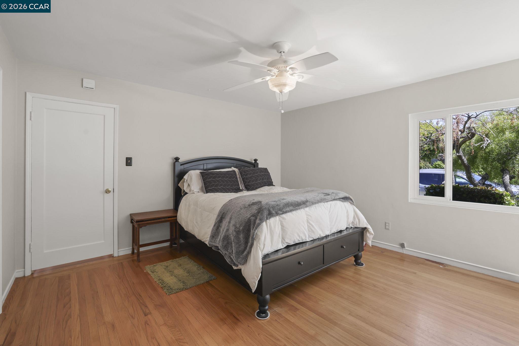 1051 San Rafael Street San Leandro, CA 94577 - Photo 18 of 26 a bedroom with a bed and window