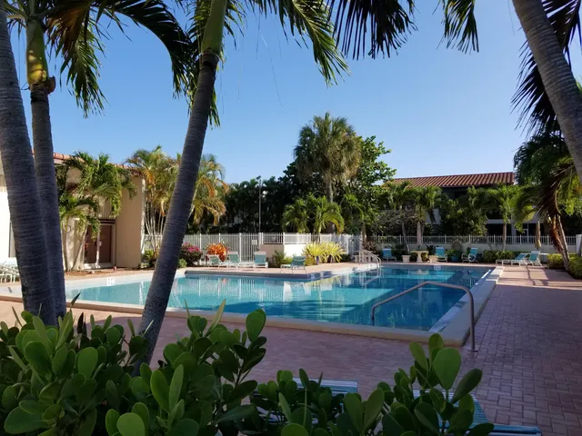 a view of a swimming pool with a patio