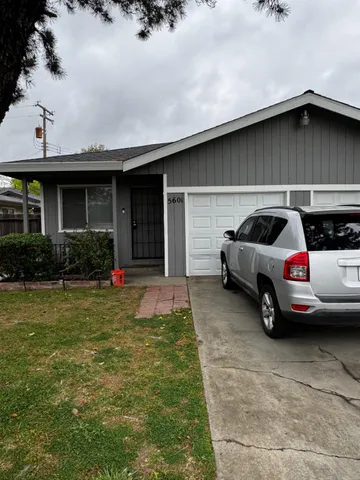 a view of car parked in front of house