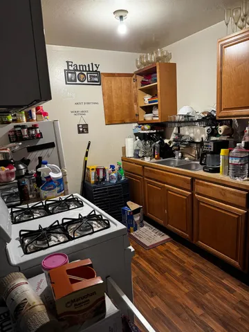 a room with wooden floor and cabinets
