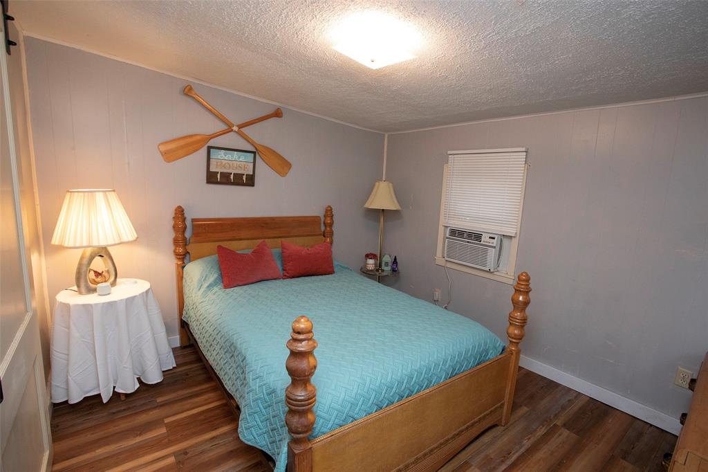 9051 Lacy Road Graford, TX 76449 - Photo 11 of 23 a bed room with a bed