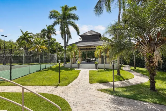 a view of a backyard with swimming pool