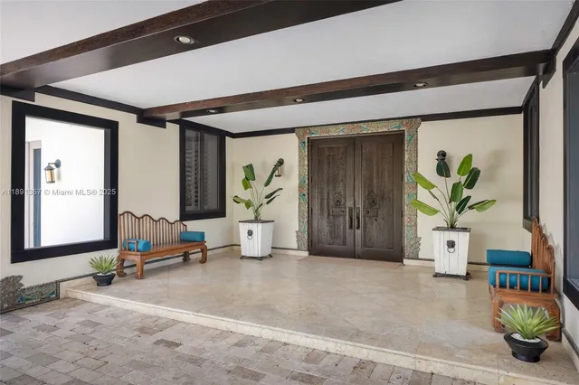 a view of a hallway with dining area and glass door