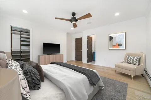 a bedroom with a bed and a couch