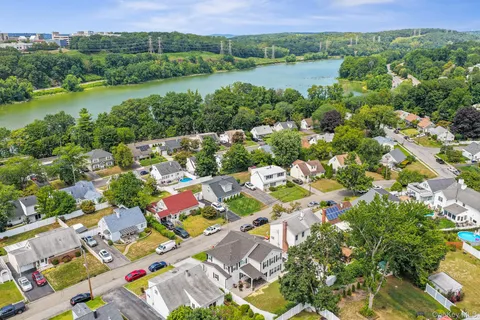 an aerial view of lake residential houses with outdoor space and lake view