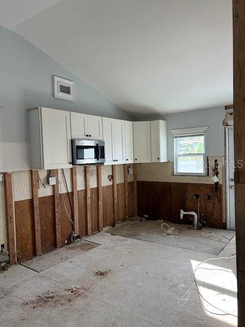 15416 2nd Street East Madeira Beach, FL 33708 - Photo 14 of 16 a kitchen with stainless steel appliances a refrigerator and a stove top oven