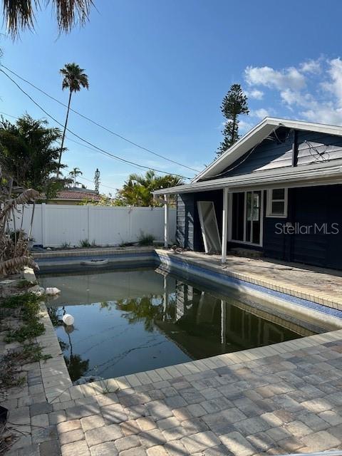 15416 2nd Street East Madeira Beach, FL 33708 - Photo 3 of 16 a view of a house with swimming pool