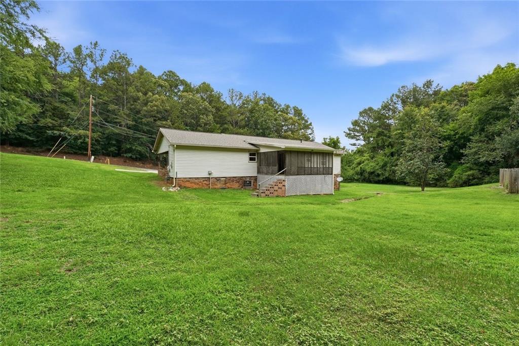 399 Donahoo Road Southeast Silver Creek, GA 30173 - Photo 19 of 22 a front view of house with yard and green space