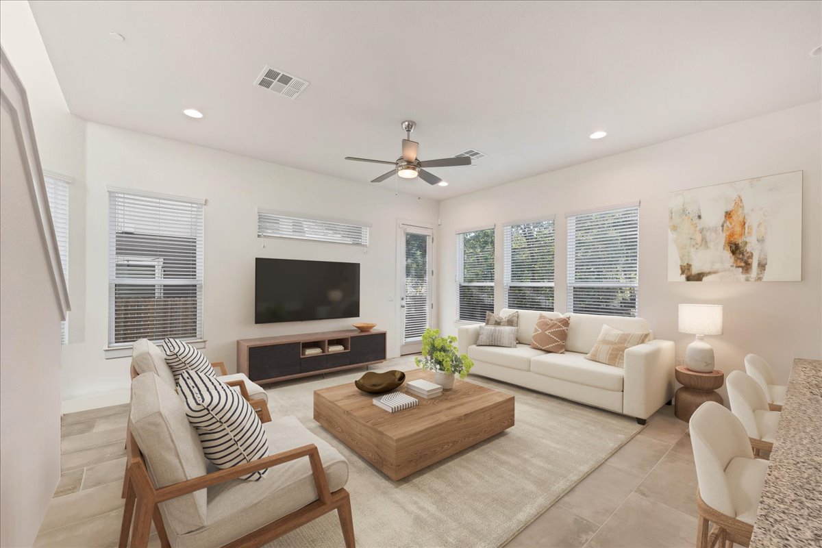 8922 Manchaca Road, Unit 906 Austin, TX 78748 - Photo 4 of 29 a living room with furniture and a flat screen tv