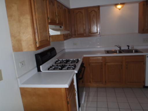 4829 West Engle Road, Unit 1D Alsip, IL 60803 - Photo 3 of 8 a kitchen with a sink a stove and cabinets
