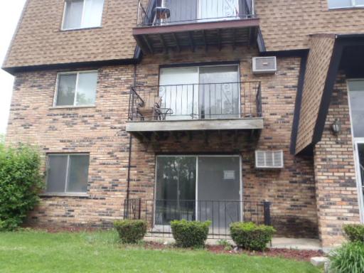 4829 West Engle Road, Unit 1D Alsip, IL 60803 - Photo 8 of 8 a front view of a house with garden