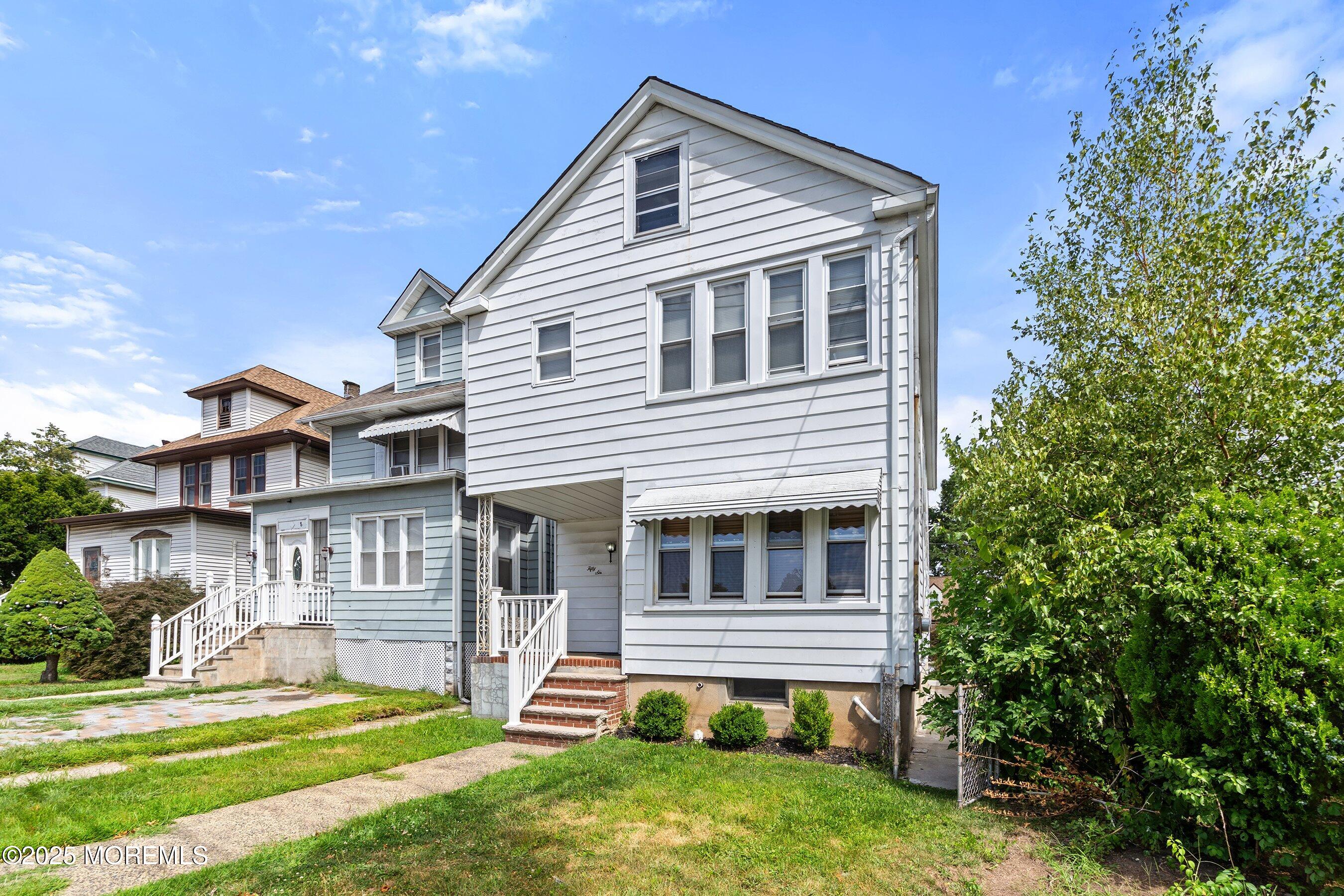 a front view of a house with a yard