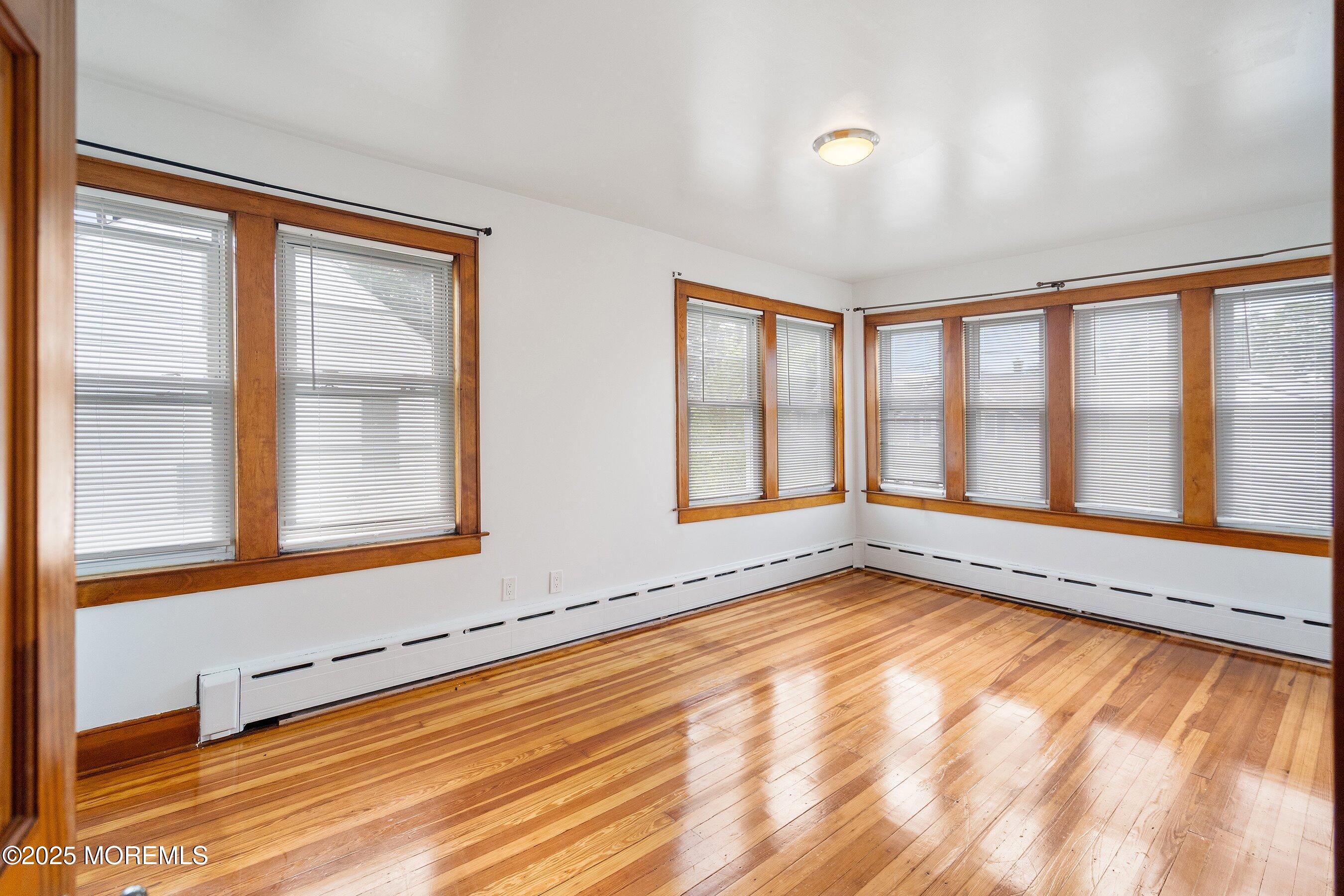 56 Ford Avenue, Unit 2 Fords, NJ 08863 - Photo 12 of 22 a view of an empty room with a window