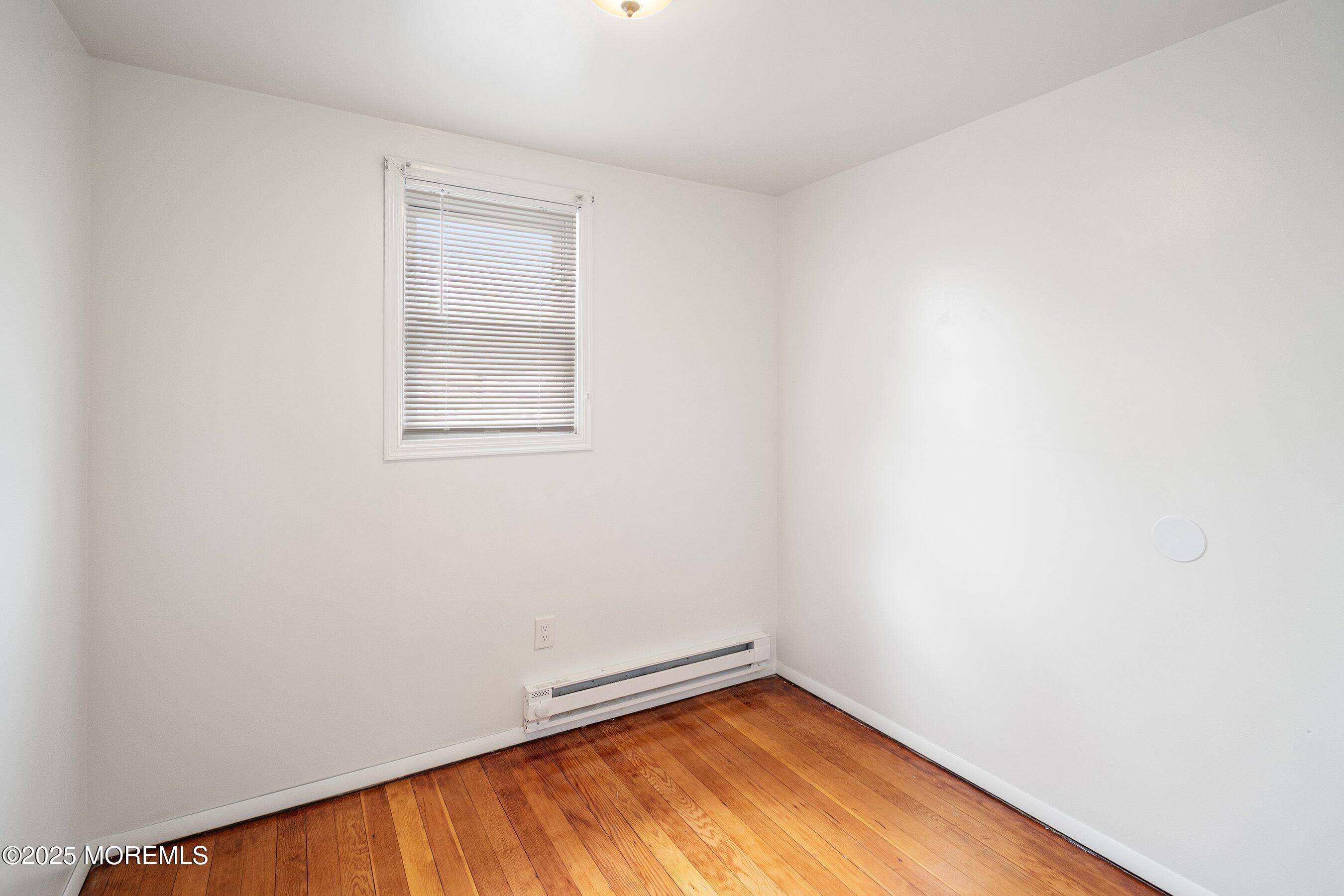56 Ford Avenue, Unit 2 Fords, NJ 08863 - Photo 15 of 22 an empty room with a window