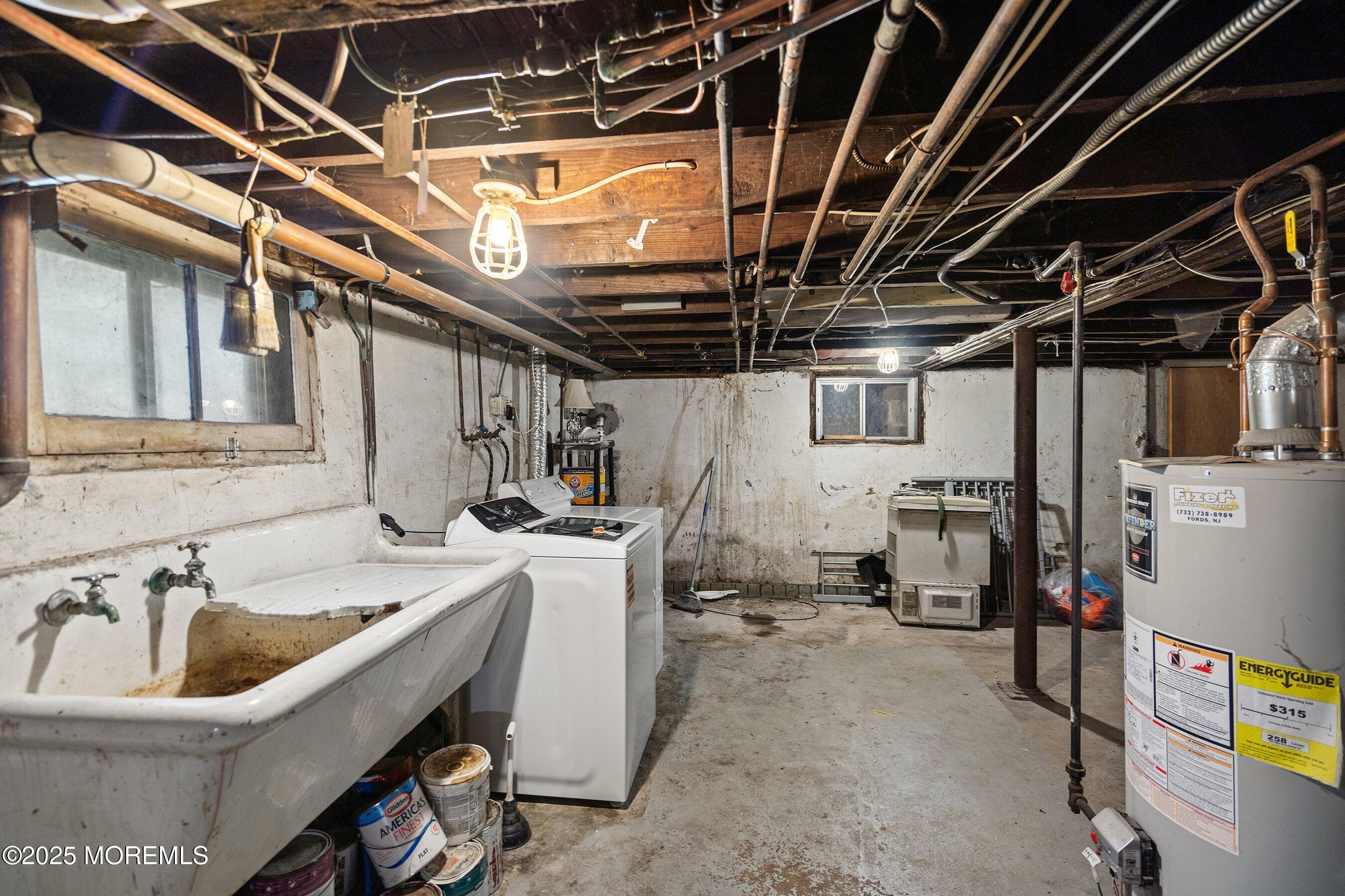 56 Ford Avenue, Unit 2 Fords, NJ 08863 - Photo 2 of 22 a utility room with dryer washer and stair
