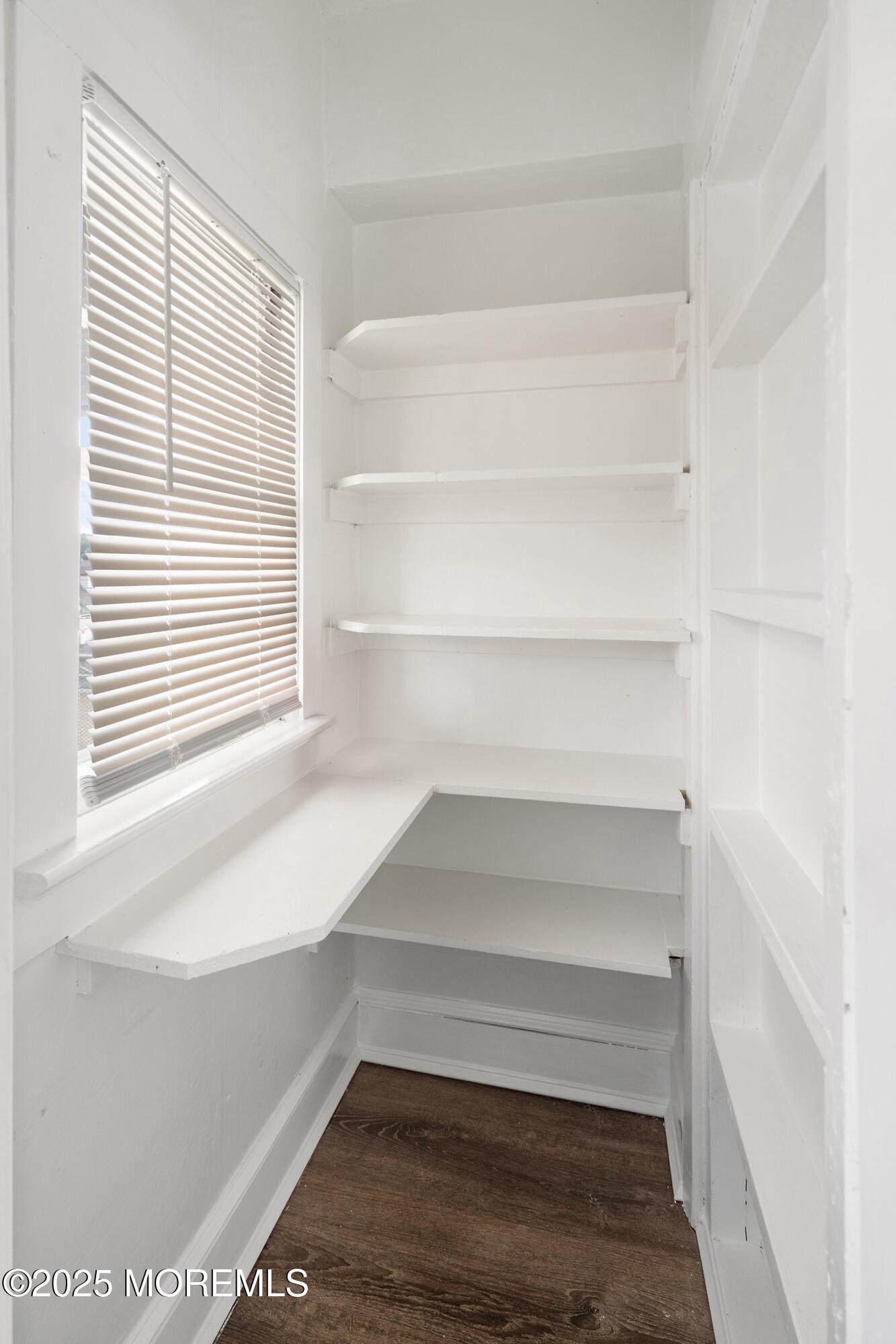 56 Ford Avenue, Unit 2 Fords, NJ 08863 - Photo 6 of 22 a view of walk in closet with empty racks