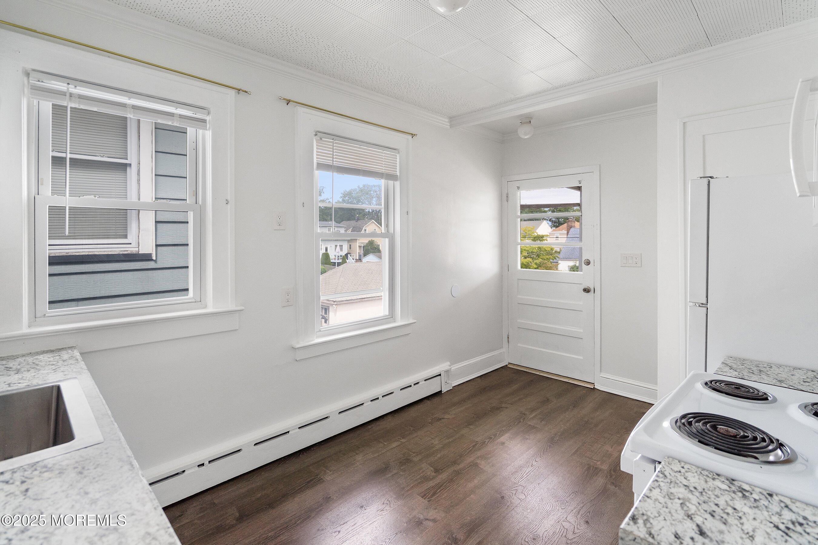 56 Ford Avenue, Unit 2 Fords, NJ 08863 - Photo 7 of 22 a view of a livingroom with wooden floor and a window