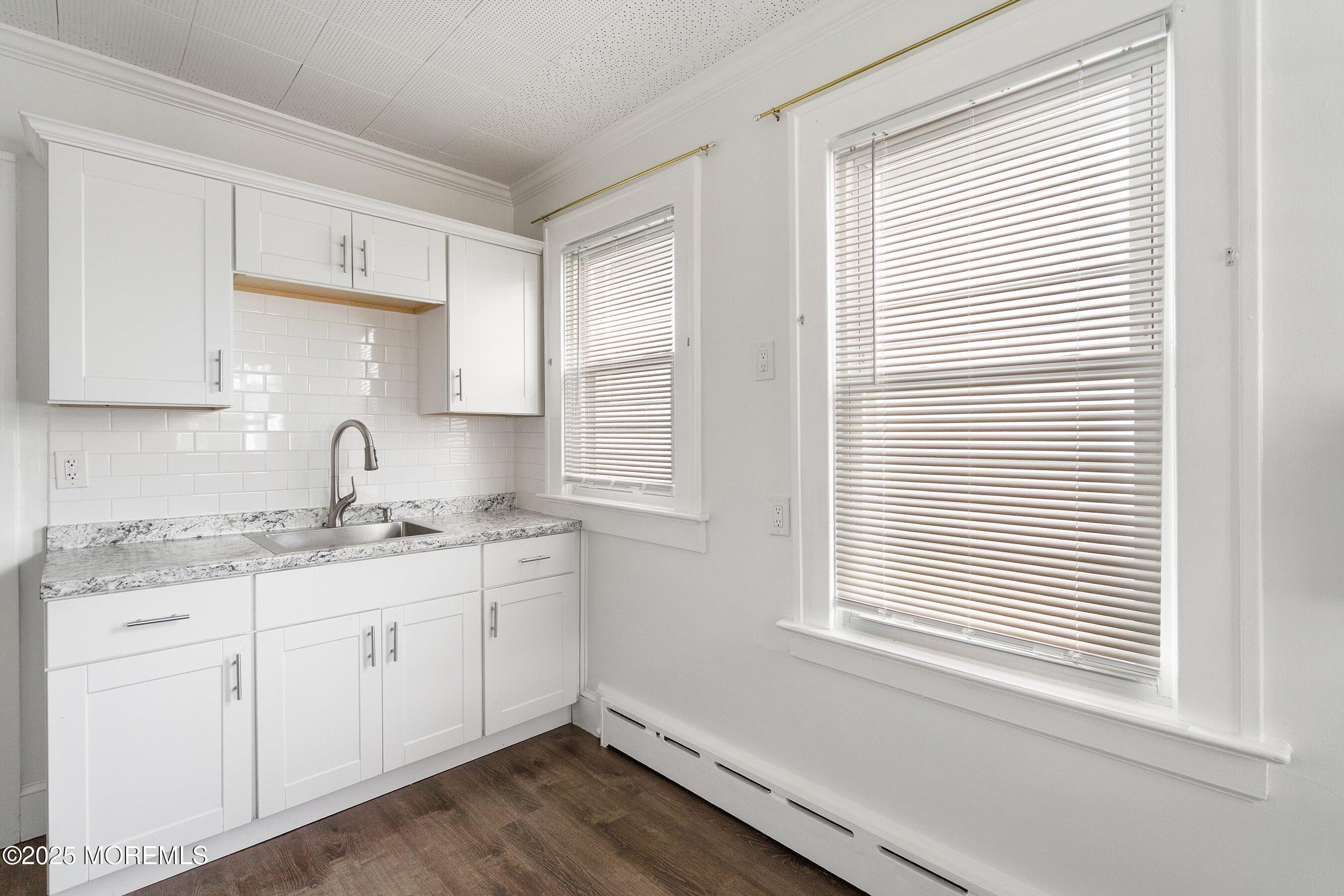 56 Ford Avenue, Unit 2 Fords, NJ 08863 - Photo 8 of 22 a kitchen with a sink cabinets and window