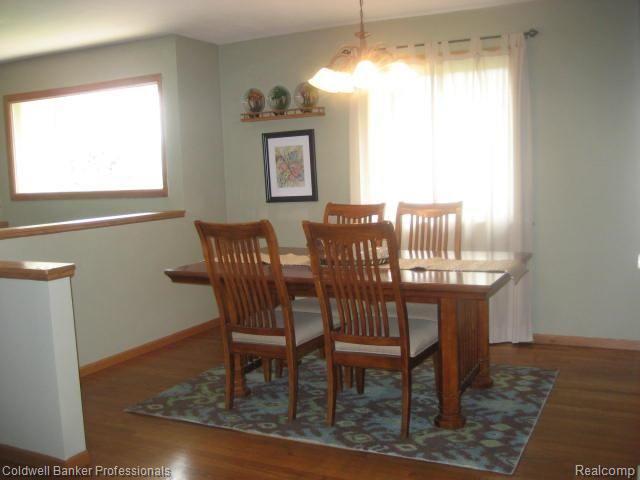70 Stark Road Rochester, MI 48307 - Photo 6 of 35 Dining Room with chandelier, hardwood floor and designer paint