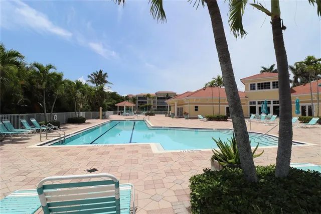 a view of swimming pool with a patio