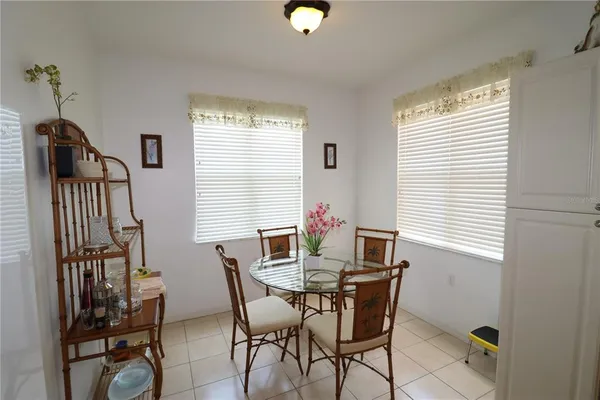 a dining room with furniture and window