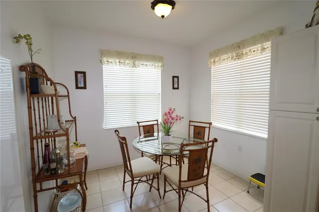 a dining room with furniture and window