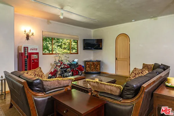 a room with furniture and a flat screen tv