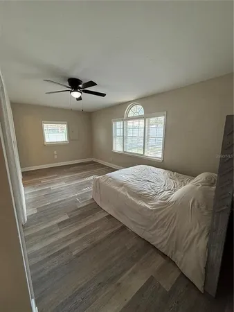 a bedroom with a bed and window