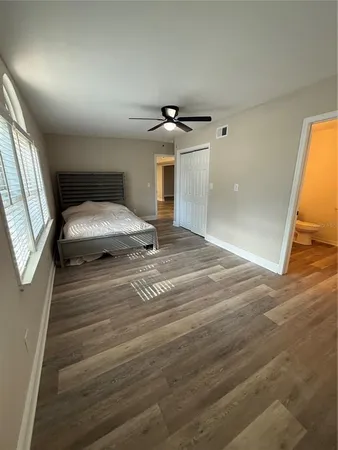 a bedroom with a bed and a walk in closet