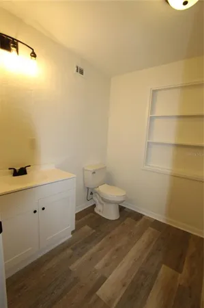 a bathroom with a toilet and a sink