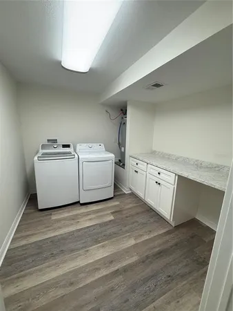 a living room with a couch and a stove top oven