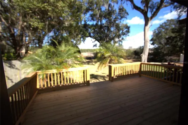 a view of a pathway with a wrought fence