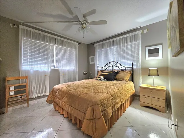 a bedroom with a bed and a table