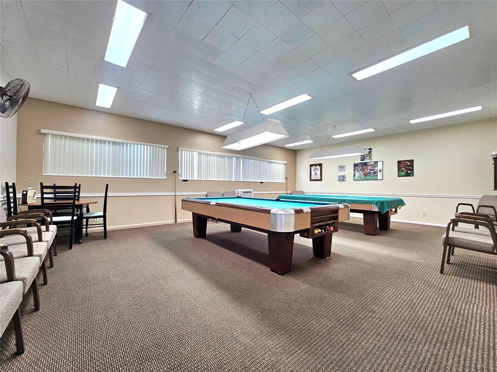 2141 Northeast 1st Court, Unit 201 Boynton Beach, FL 33435 - Photo 21 of 26 a living room with furniture and a table