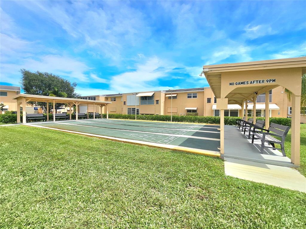 2141 Northeast 1st Court, Unit 201 Boynton Beach, FL 33435 - Photo 24 of 26 a house view with a outdoor space