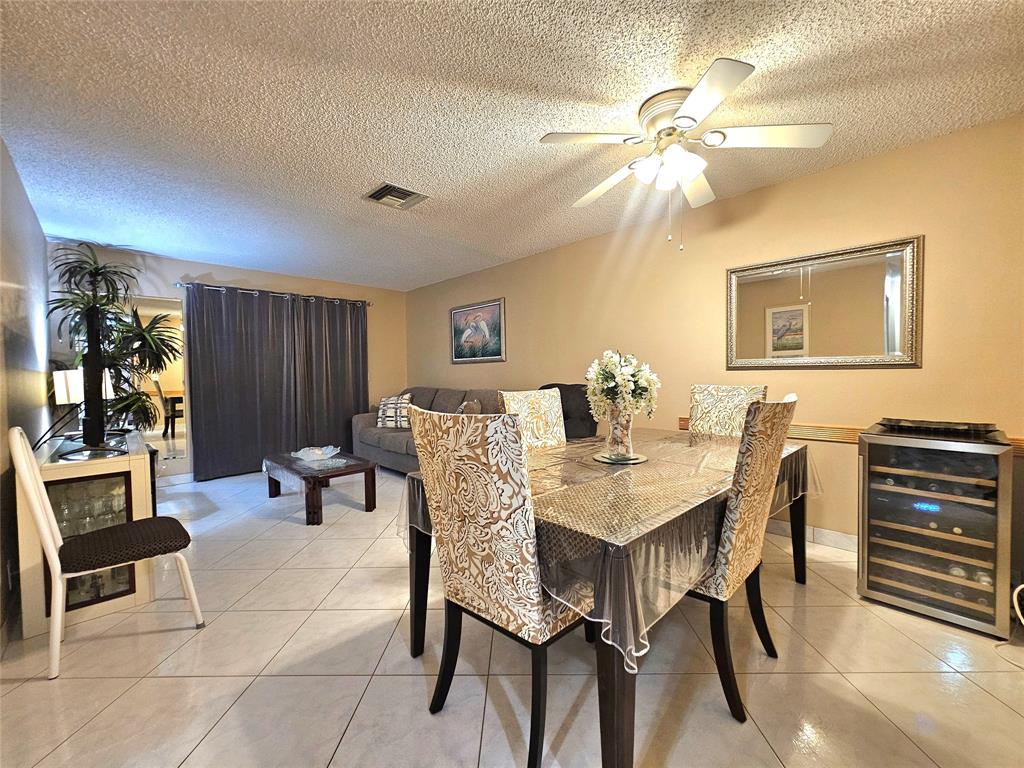 2141 Northeast 1st Court, Unit 201 Boynton Beach, FL 33435 - Photo 4 of 26 a view of a dining room with furniture