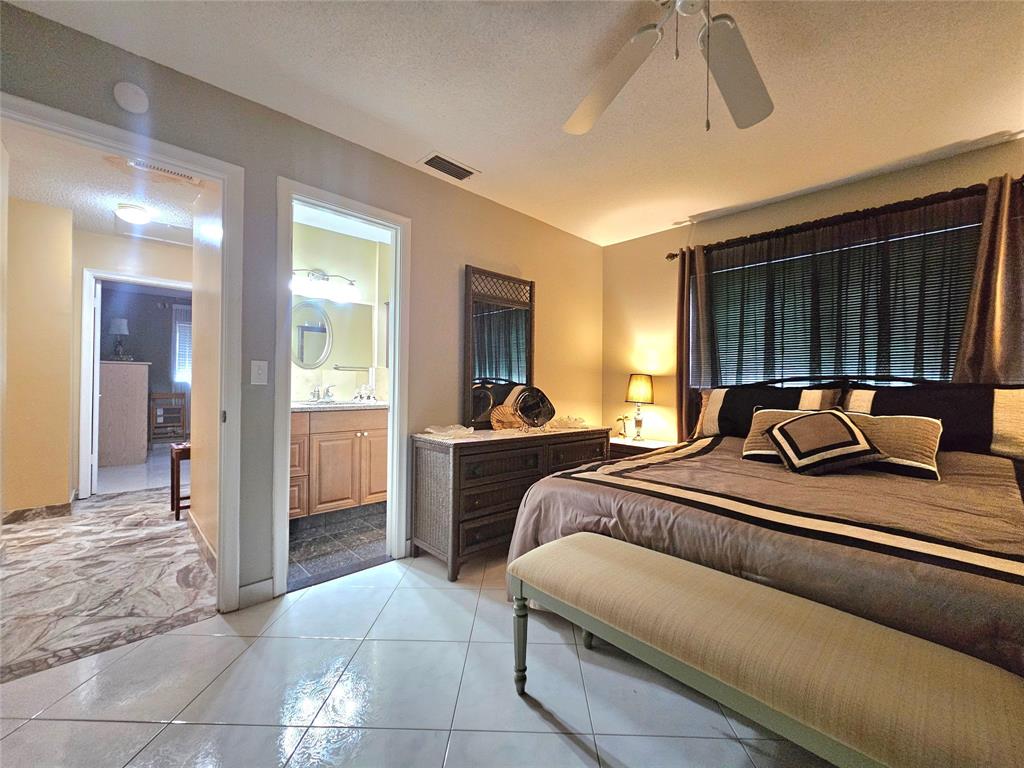 2141 Northeast 1st Court, Unit 201 Boynton Beach, FL 33435 - Photo 9 of 26 a living room with furniture and a window